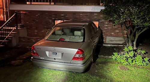 BC man loses control while ‘doing donuts,’ lodges vehicle into house